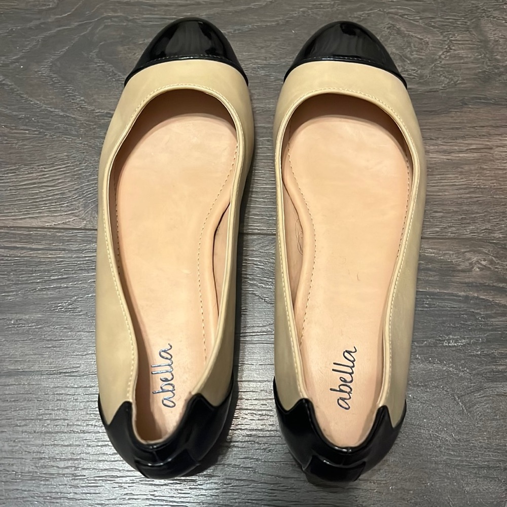 Nude and black ballet flats